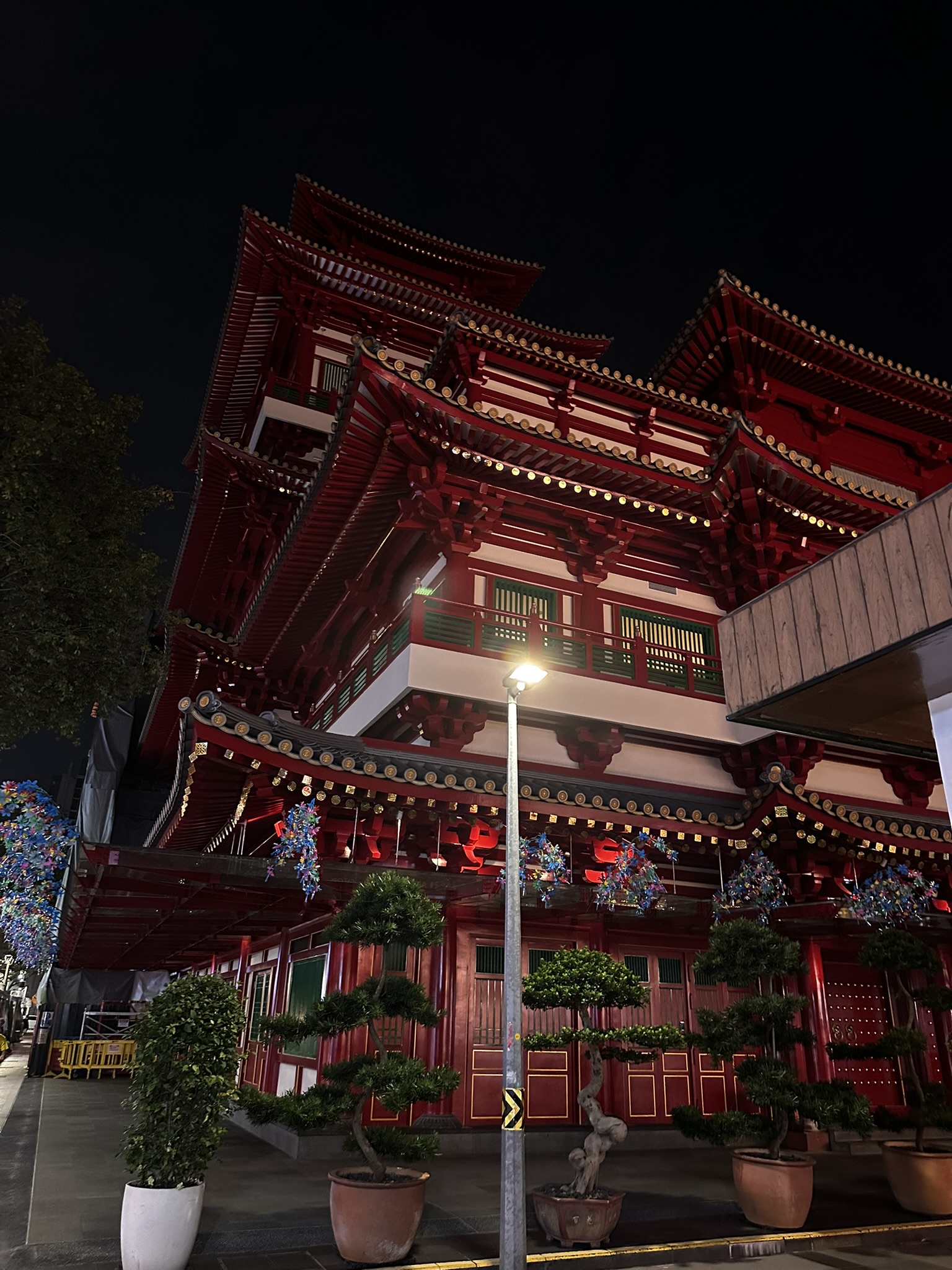 Buddha Tooth Relic Temple in Singapore's Chinatown, lit up at night