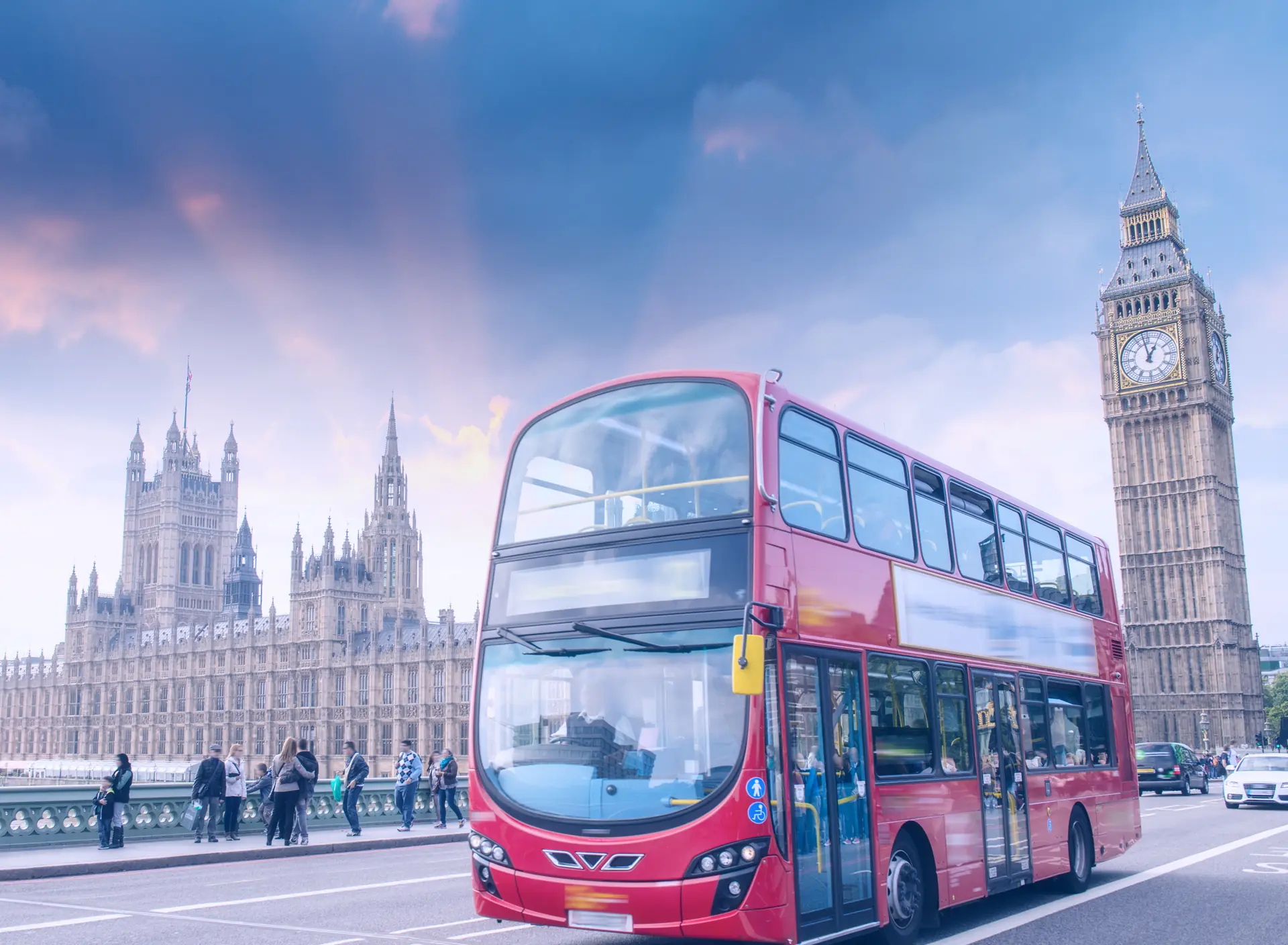 London red bus on Westminster Bridge with Big Ben and the Houses of Parliament