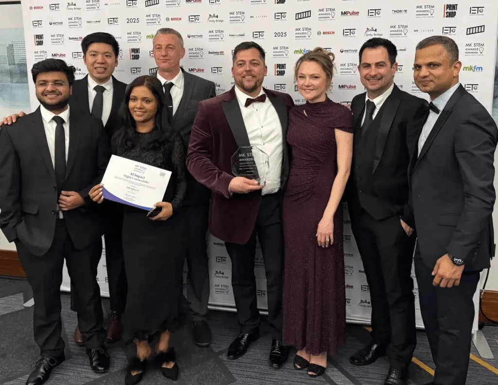 PODTECH team celebrating at the MK STEM Awards 2025 ceremony holding the AI Impact Award
